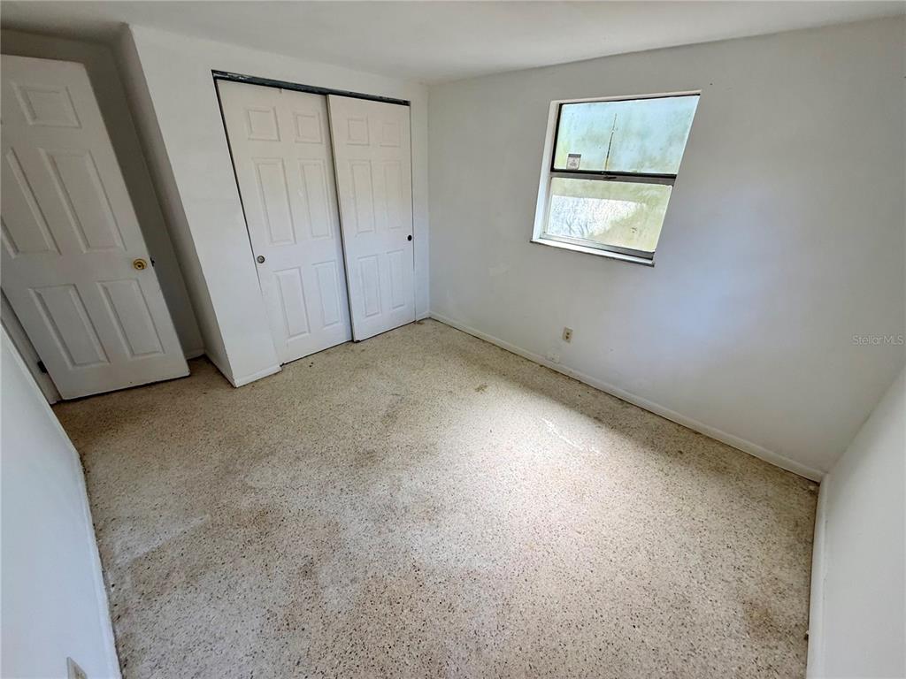 1134 Engman Street Clearwater, FL 33755 - Photo 19 of 27 an empty room with windows and closet