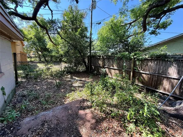 a backyard of a house with lots of green space