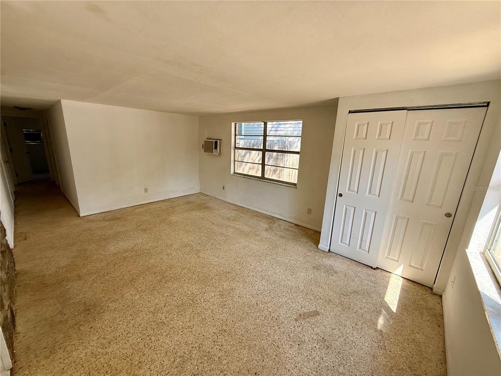 1134 Engman Street Clearwater, FL 33755 - Photo 3 of 27 an empty room with windows