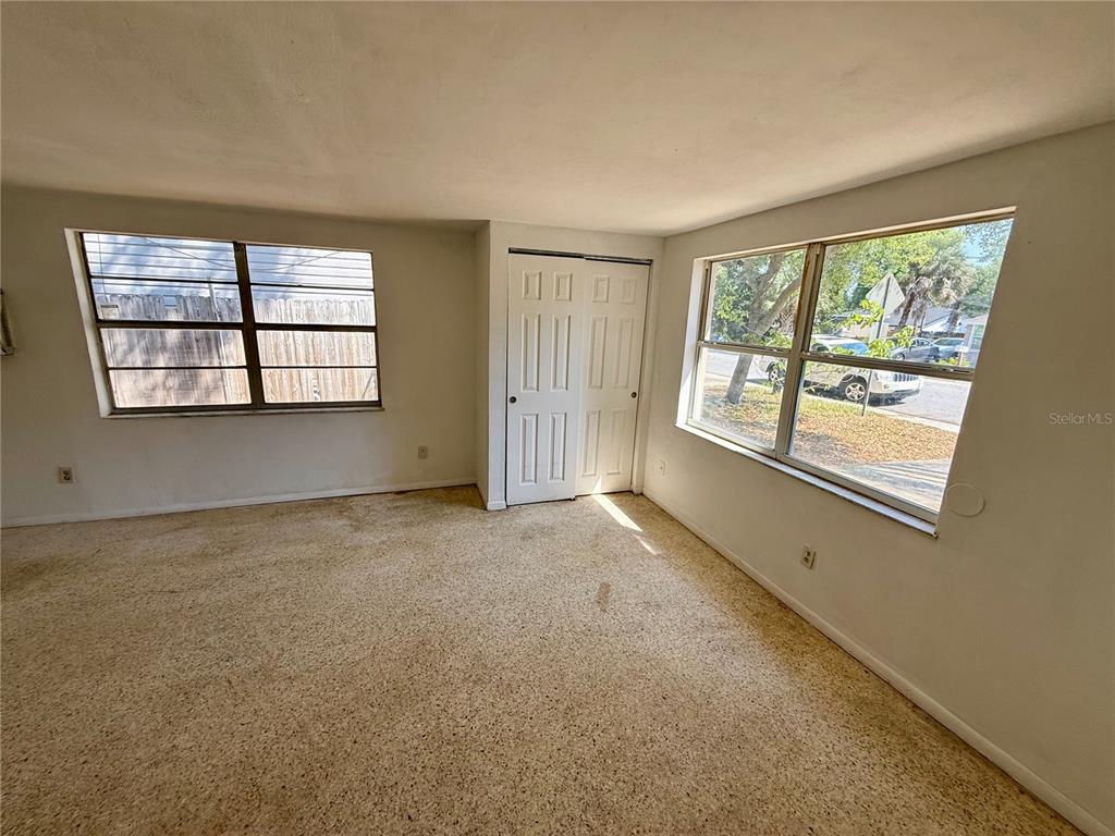 1134 Engman Street Clearwater, FL 33755 - Photo 4 of 27 an empty room with windows