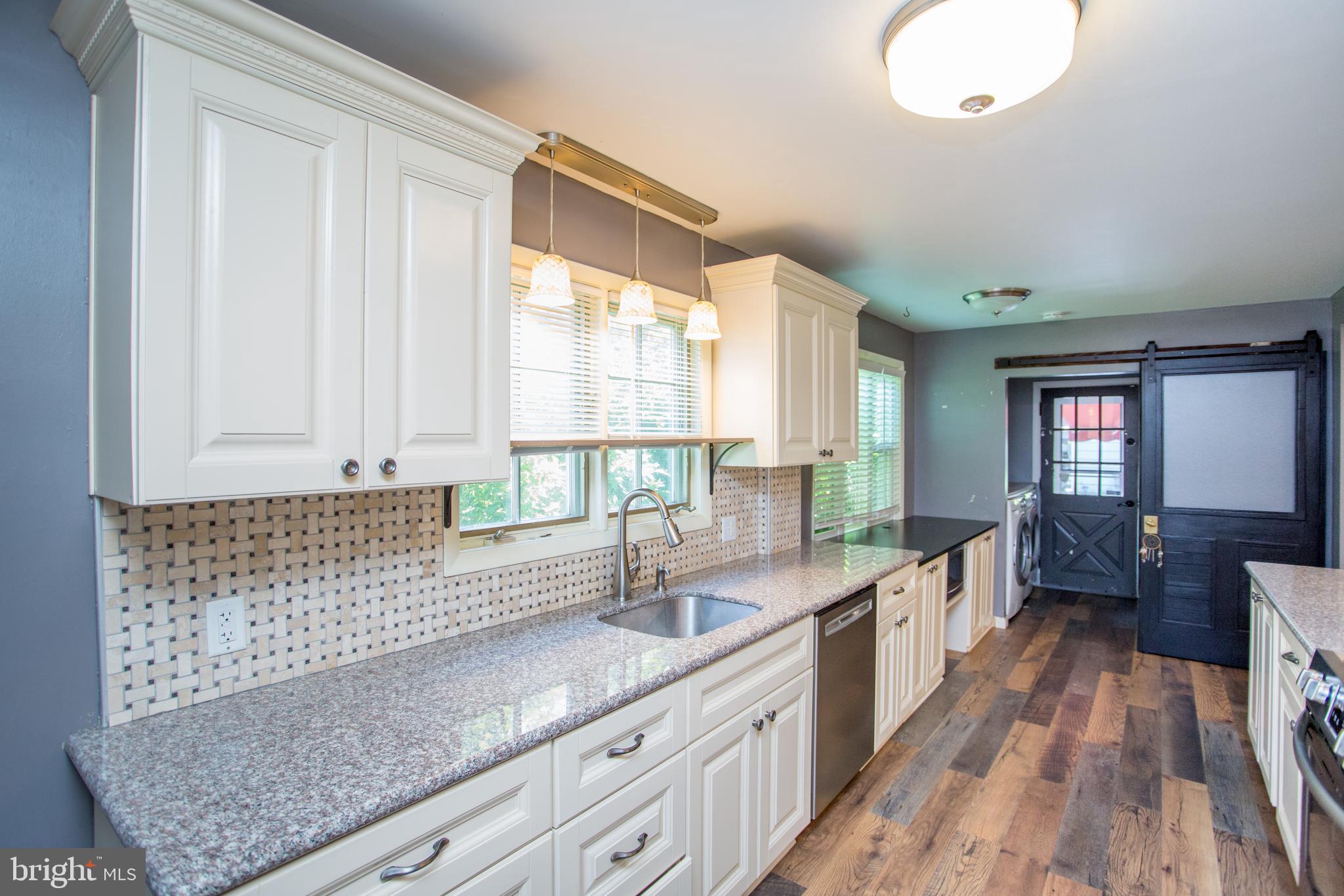 105 Wilson Avenue Hellertown, PA 18055 - Photo 16 of 46 a large white kitchen with a large window