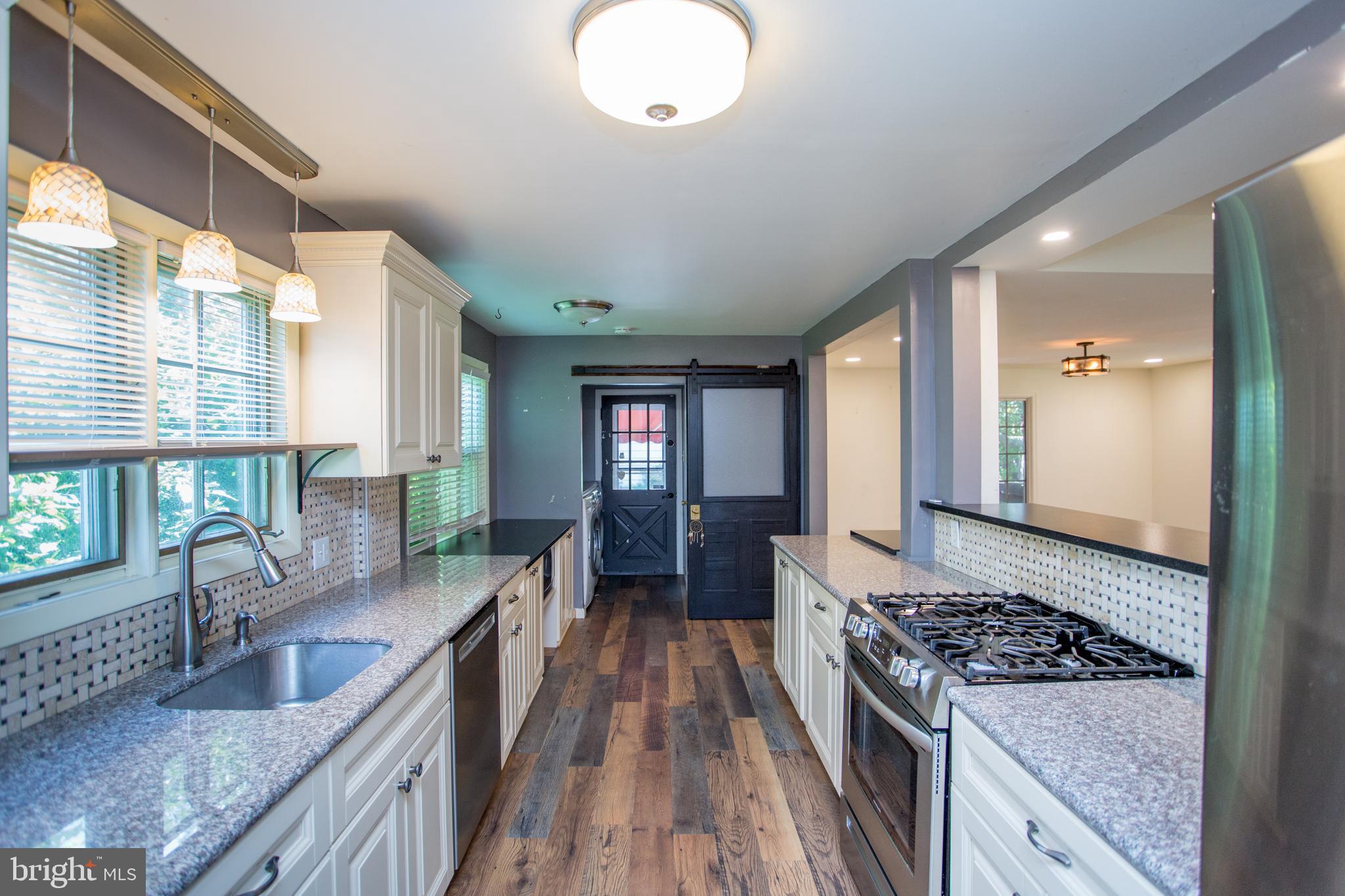105 Wilson Avenue Hellertown, PA 18055 - Photo 17 of 46 a kitchen with sink stove and refrigerator