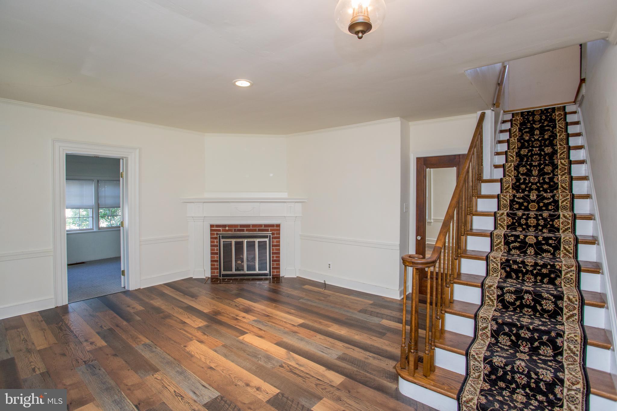 105 Wilson Avenue Hellertown, PA 18055 - Photo 21 of 46 a view of an empty room with window and wooden floor