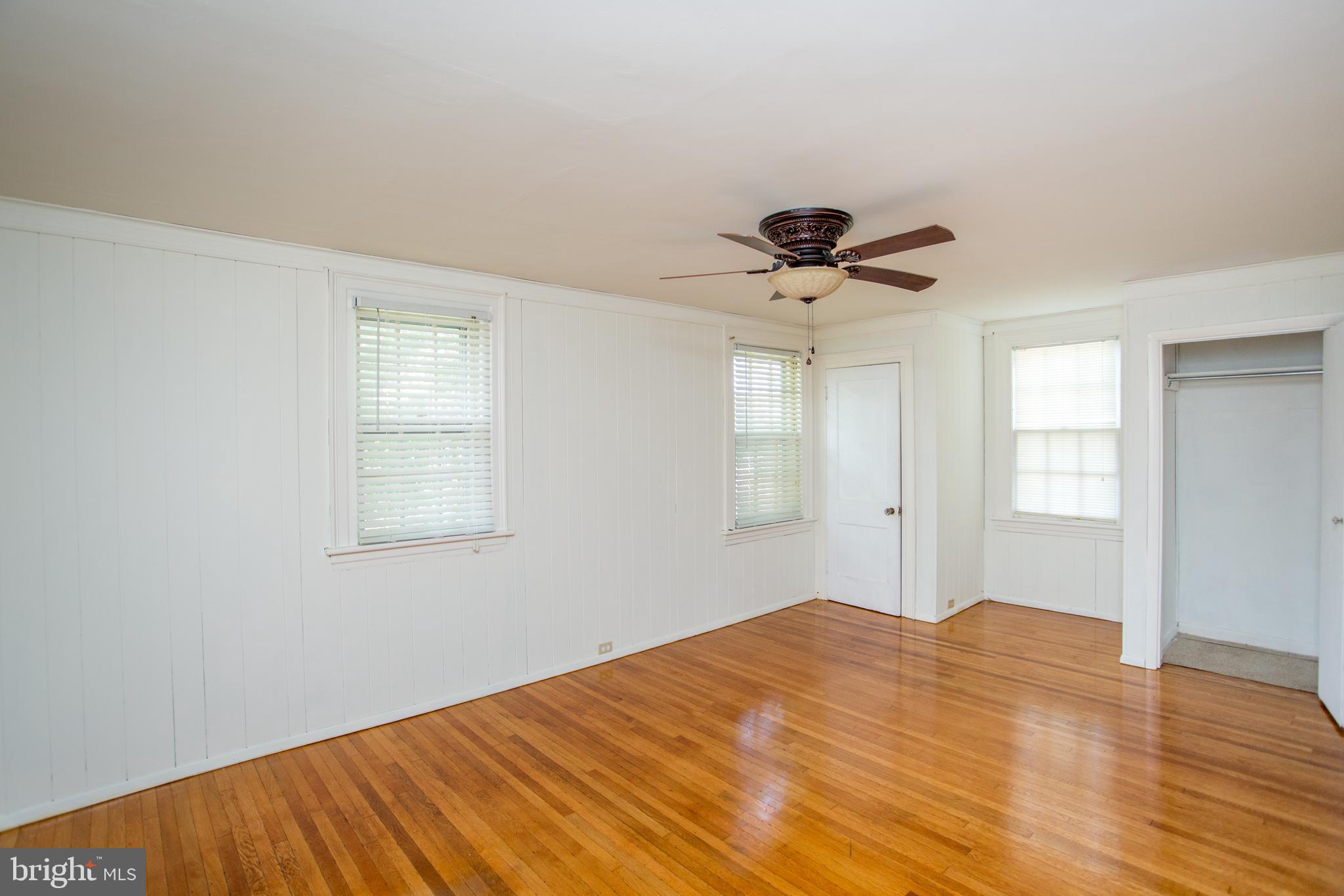 105 Wilson Avenue Hellertown, PA 18055 - Photo 23 of 46 a big room with wooden floor and chandelier fan