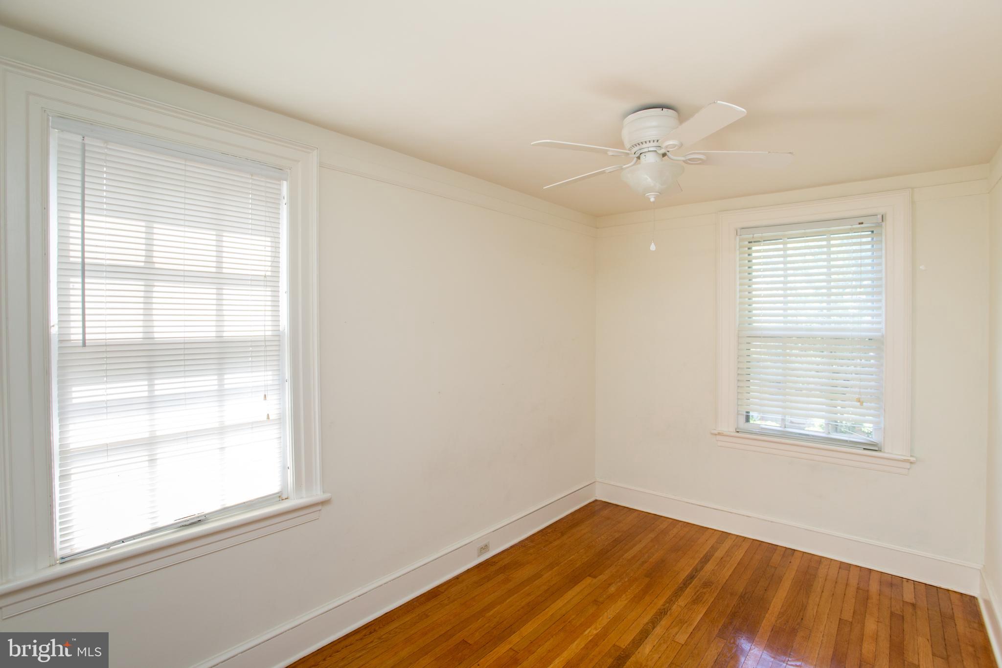 105 Wilson Avenue Hellertown, PA 18055 - Photo 25 of 46 an empty room with a window and wooden floor