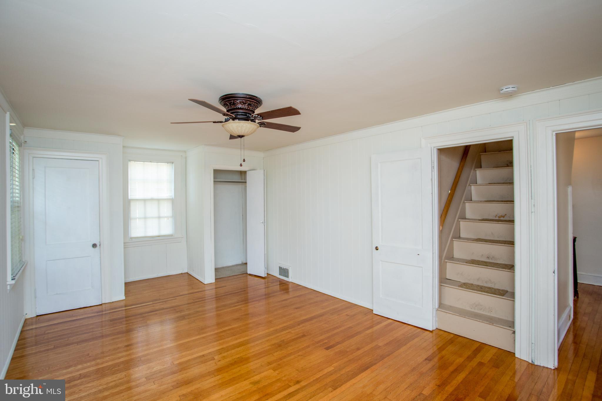 105 Wilson Avenue Hellertown, PA 18055 - Photo 28 of 46 a view of a bedroom with wooden floor and a ceiling fan