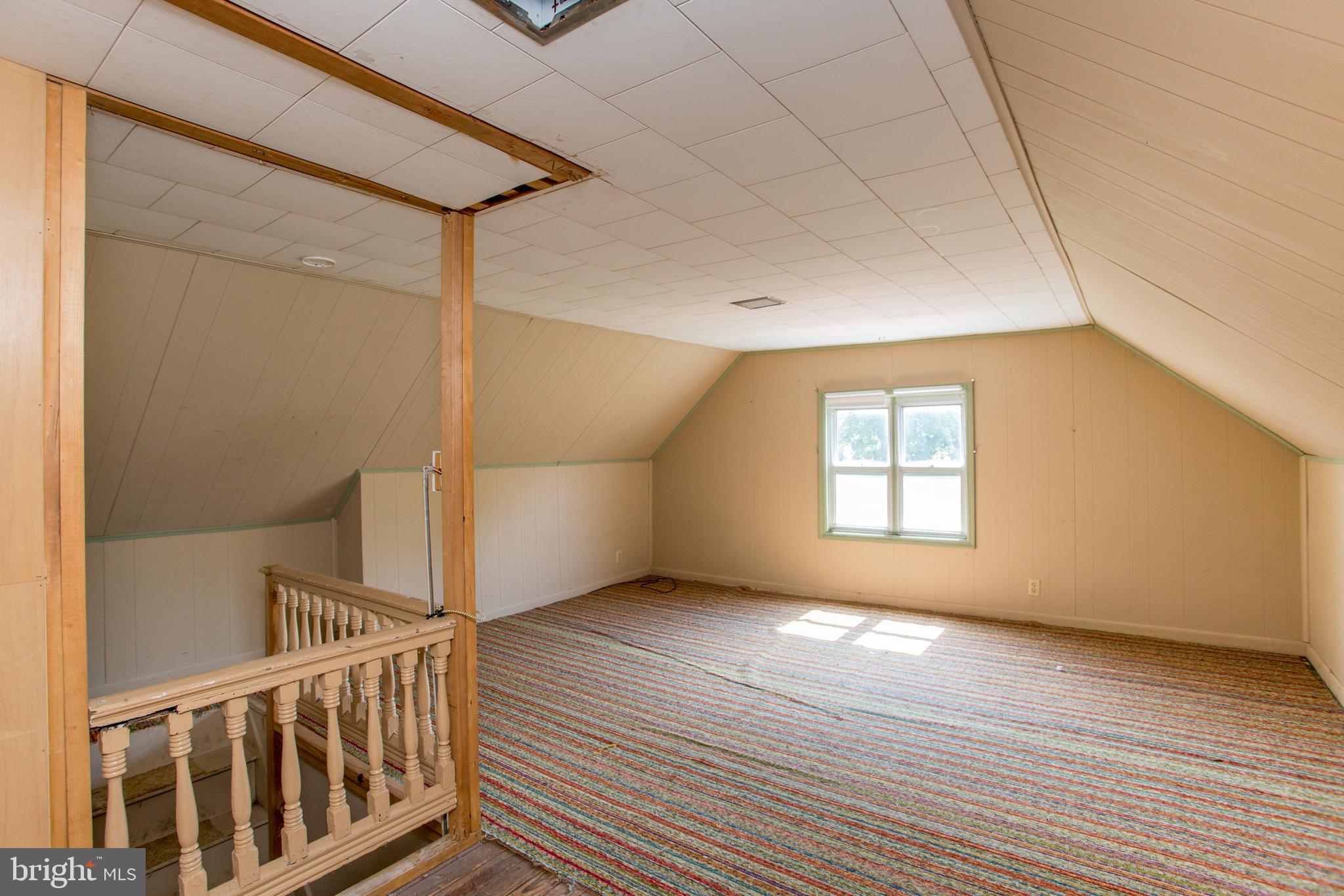 105 Wilson Avenue Hellertown, PA 18055 - Photo 29 of 46 a view of an empty room with wooden floor and a window