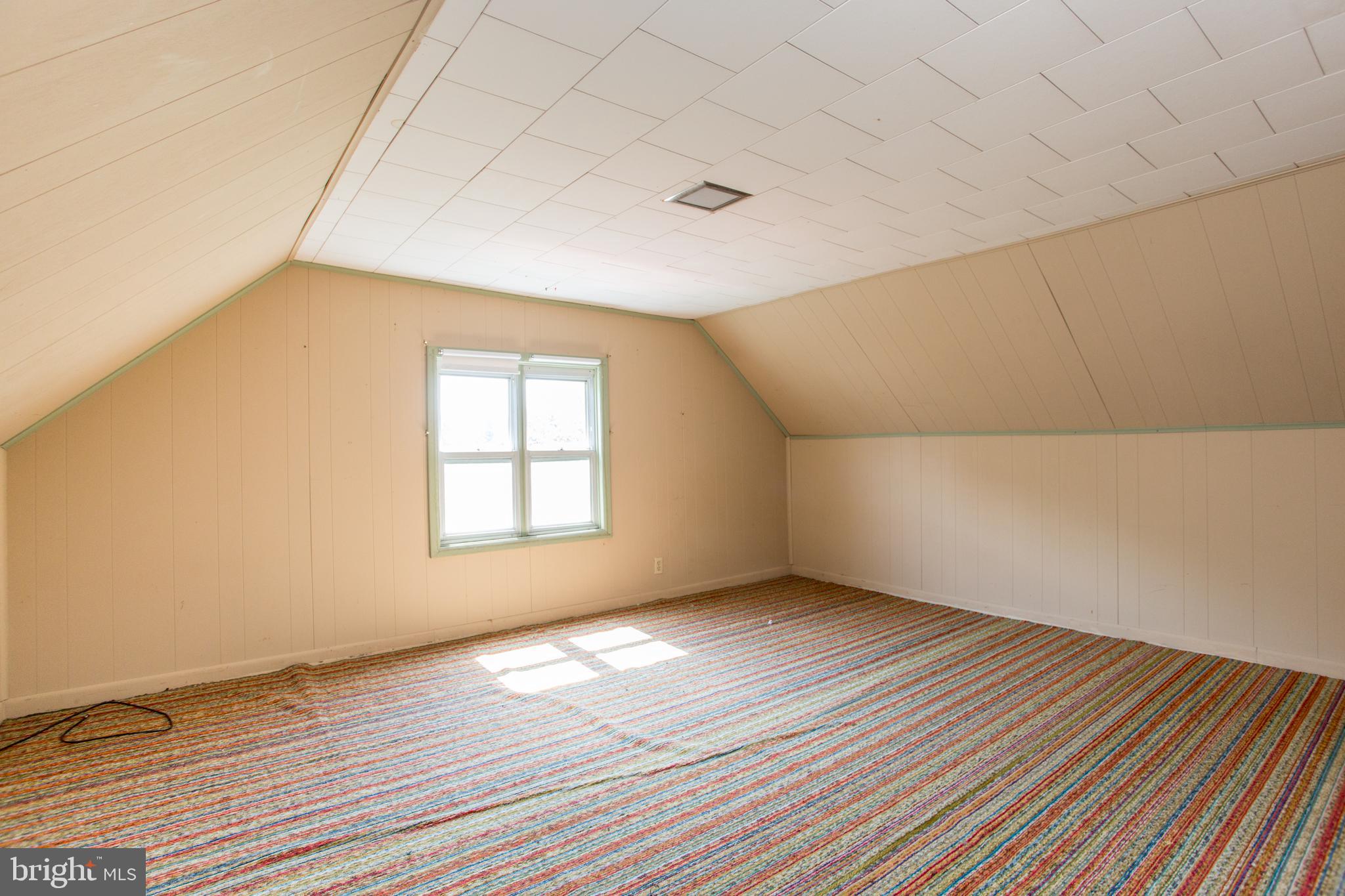 105 Wilson Avenue Hellertown, PA 18055 - Photo 30 of 46 an empty room with wooden floor and windows