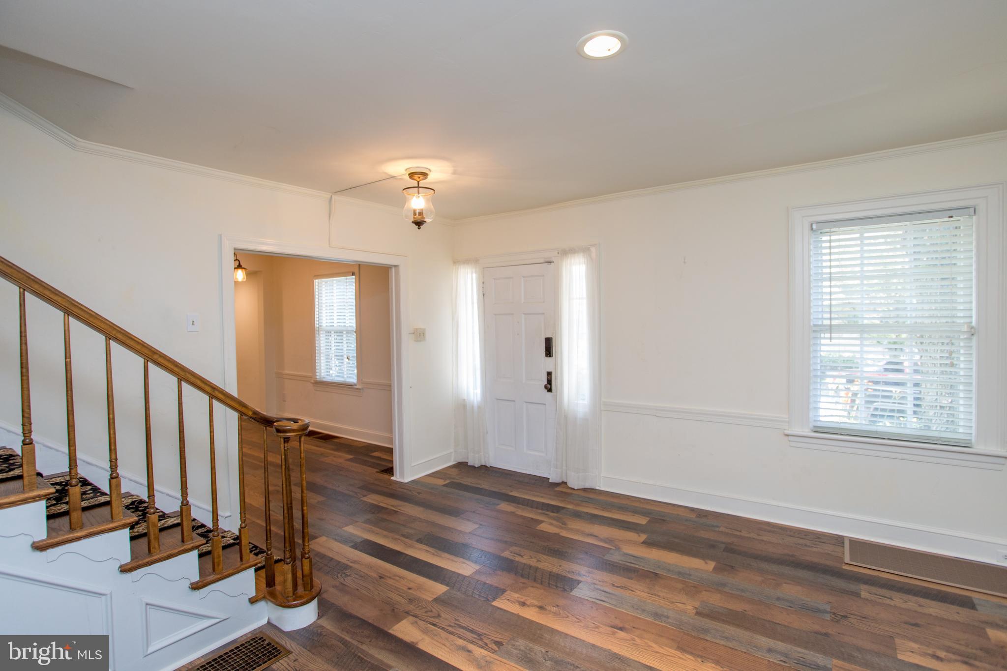 105 Wilson Avenue Hellertown, PA 18055 - Photo 4 of 46 a view of an entryway with wooden floor and door