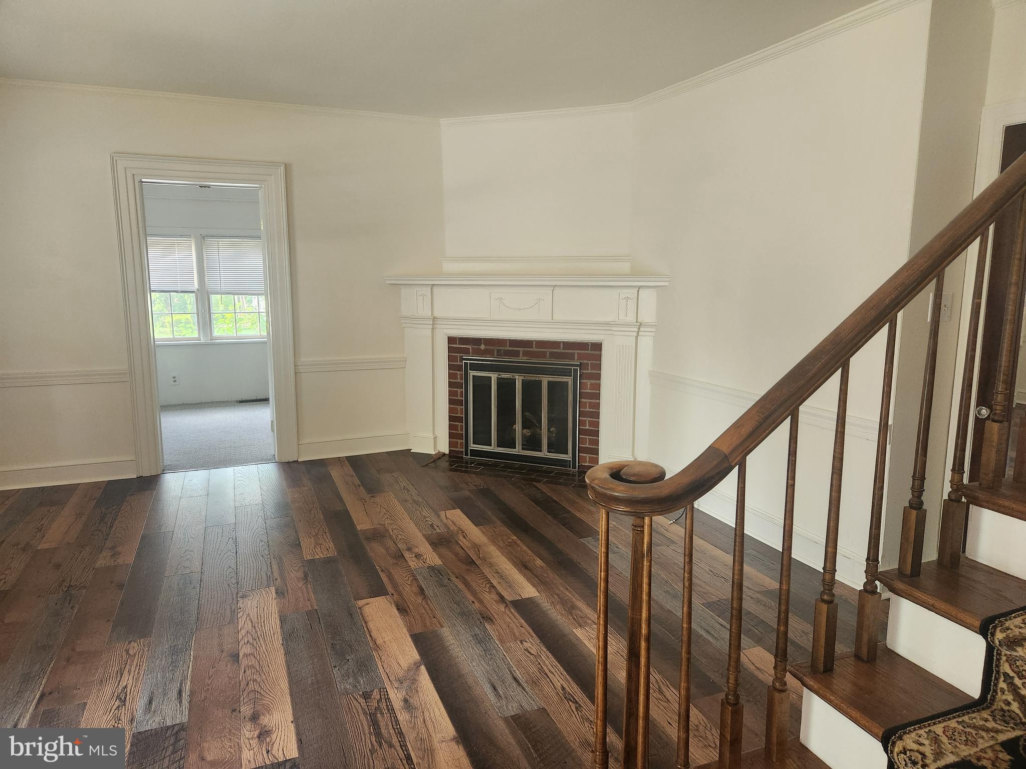 105 Wilson Avenue Hellertown, PA 18055 - Photo 5 of 46 a view of an entryway with wooden floor and a fireplace