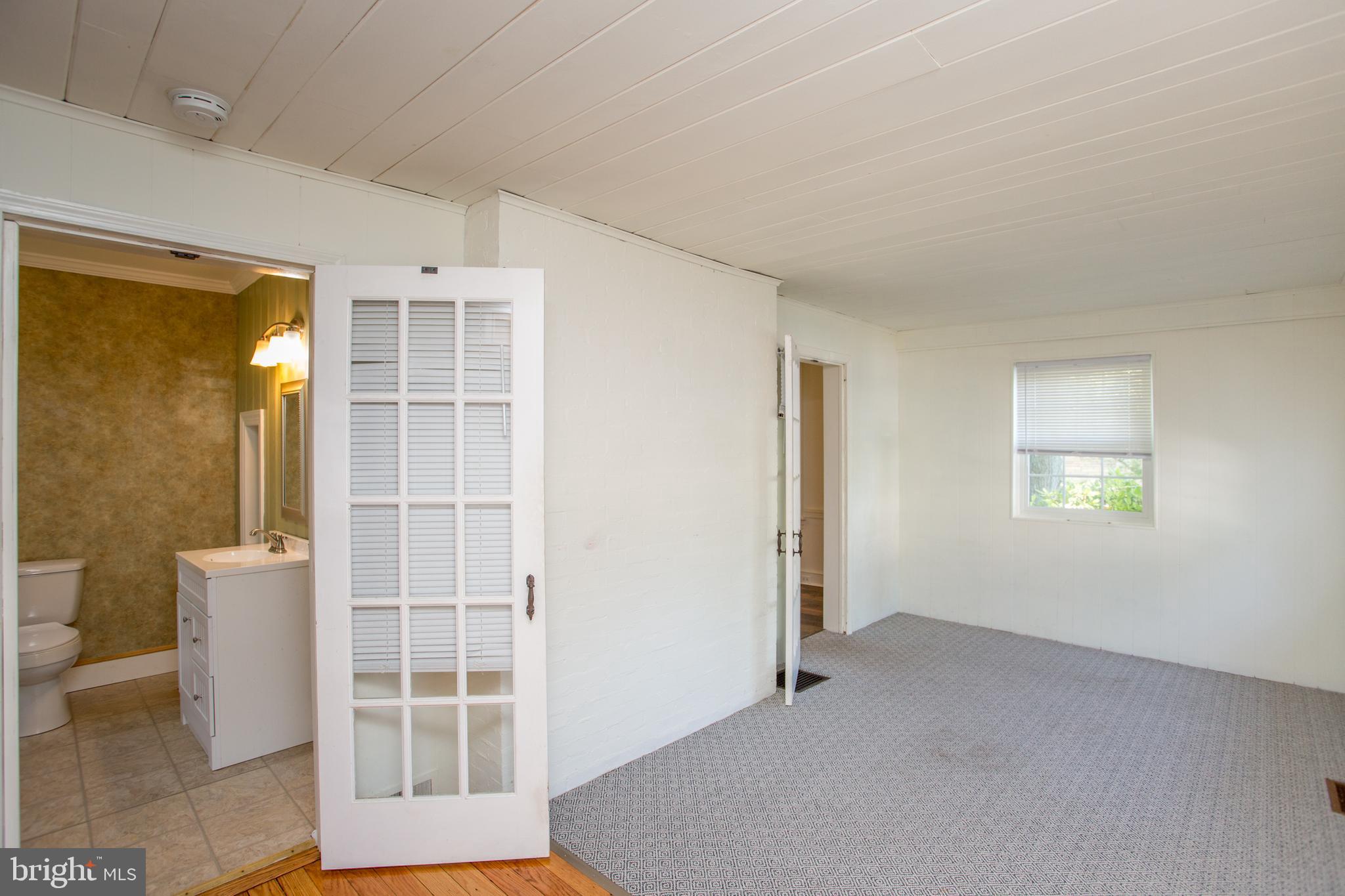 105 Wilson Avenue Hellertown, PA 18055 - Photo 8 of 46 a view of an empty room with a window