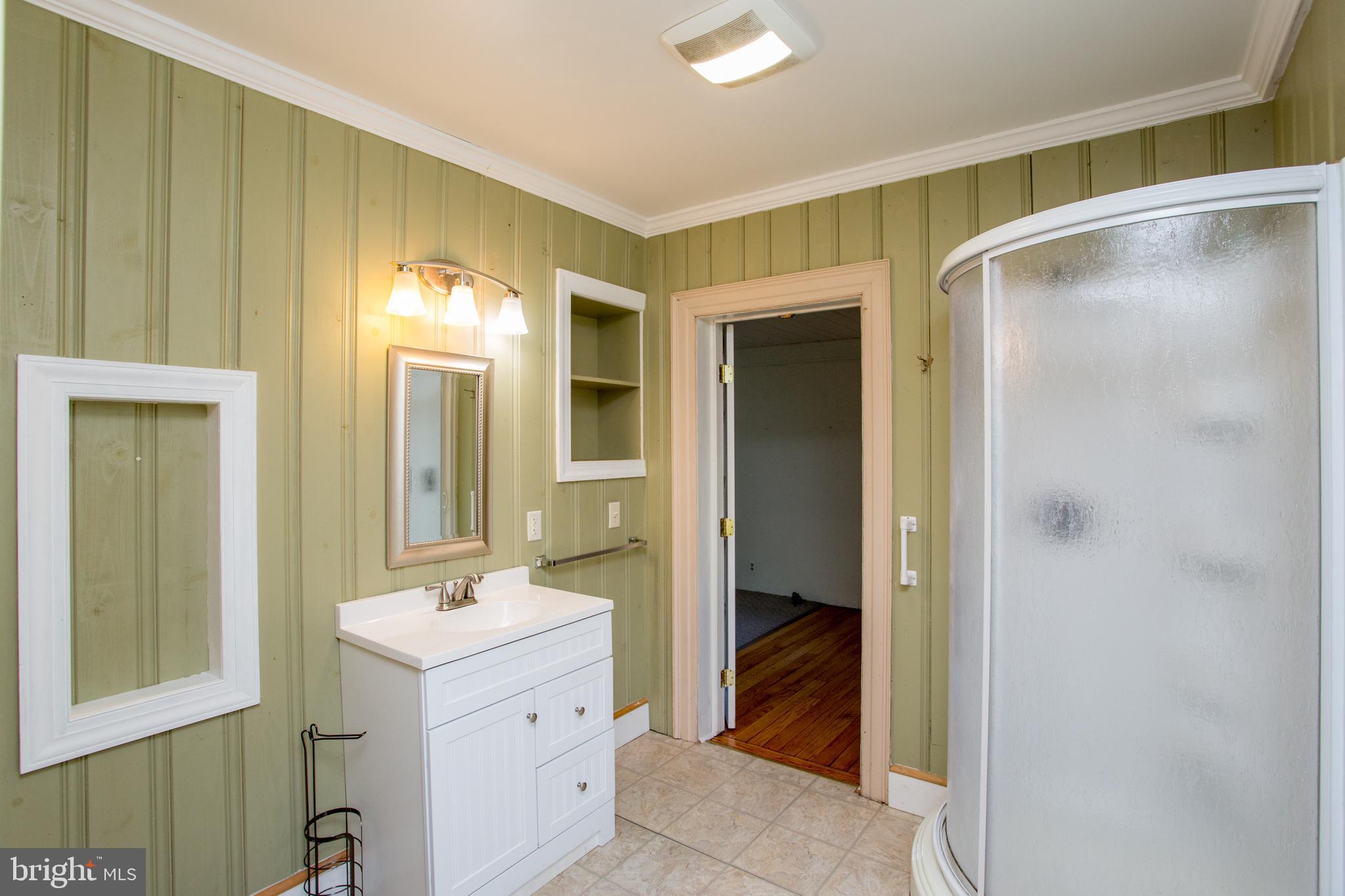 105 Wilson Avenue Hellertown, PA 18055 - Photo 9 of 46 a bathroom with a sink and a mirror