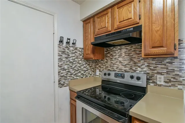 a kitchen with a stove and a microwave