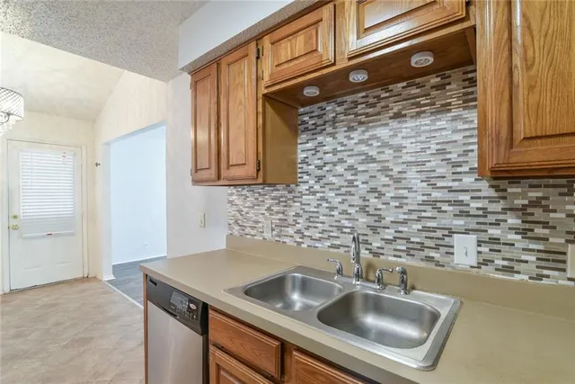 a kitchen with a sink cabinets and utility