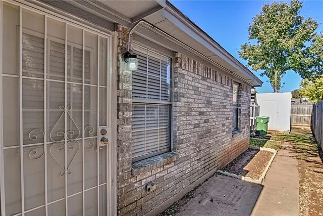 a view of a door and a window
