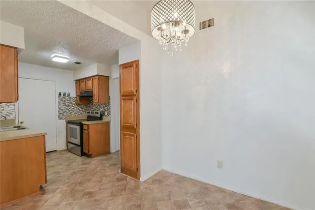 a view of a kitchen with a sink