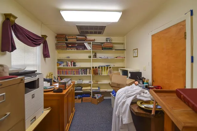 a bed room with a bed and a desk