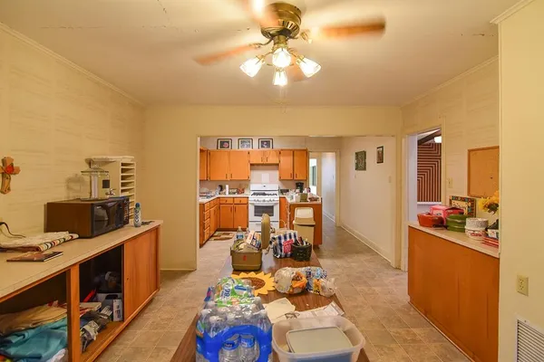 a view of a workspace with furniture and a kitchen