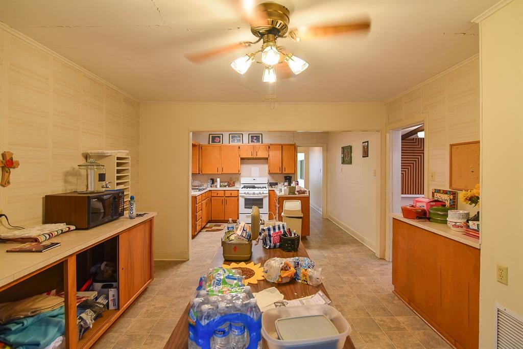 4403 Phillips Drive Wichita Falls, TX 76308 - Photo 12 of 40 a view of a workspace with furniture and a kitchen