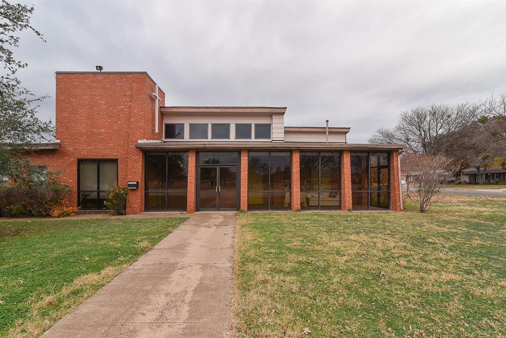 4403 Phillips Drive Wichita Falls, TX 76308 - Photo 2 of 40 a front view of a house with a yard and garage