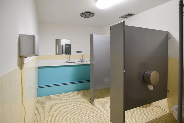 an empty room with a empty space and a window