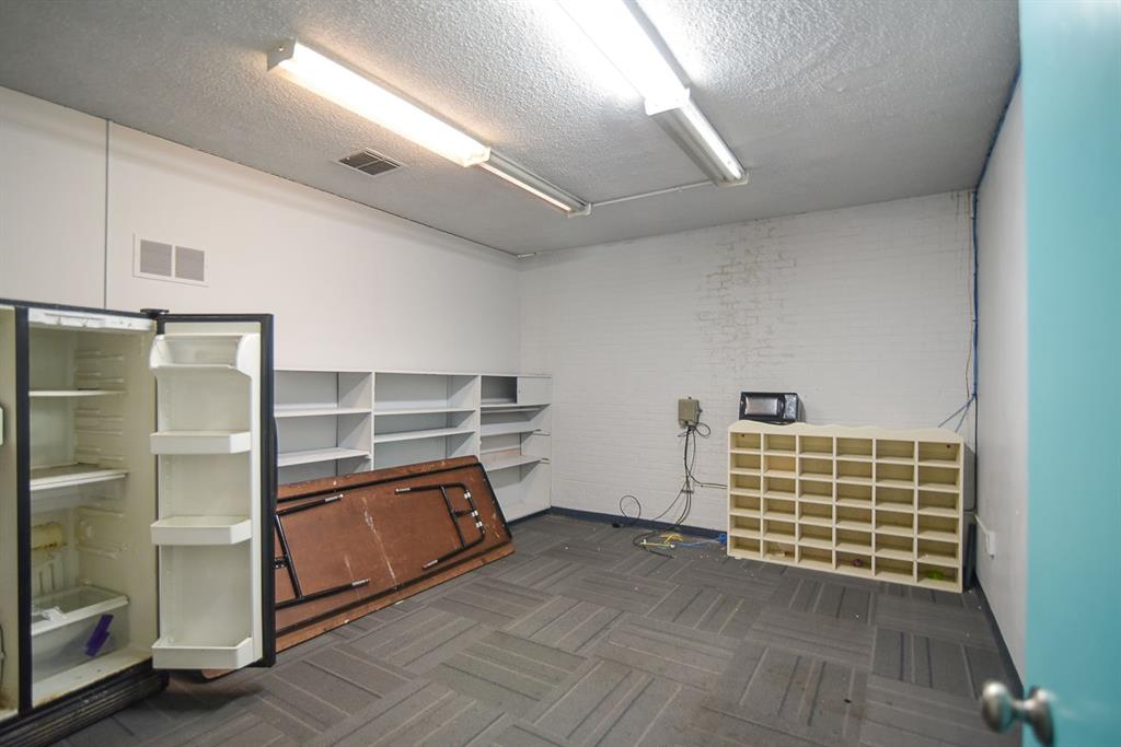 4403 Phillips Drive Wichita Falls, TX 76308 - Photo 23 of 40 a view of an empty room with wooden floor and windows