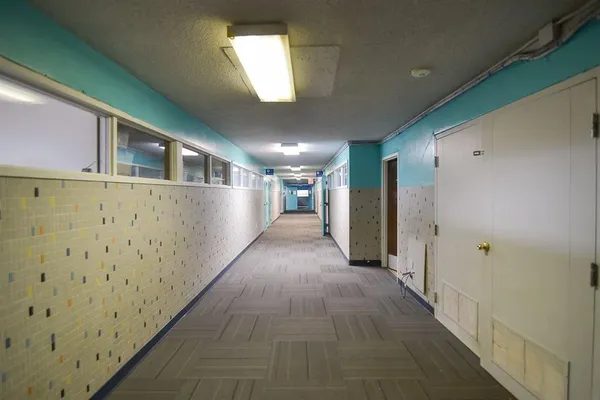a view of an empty room with a window