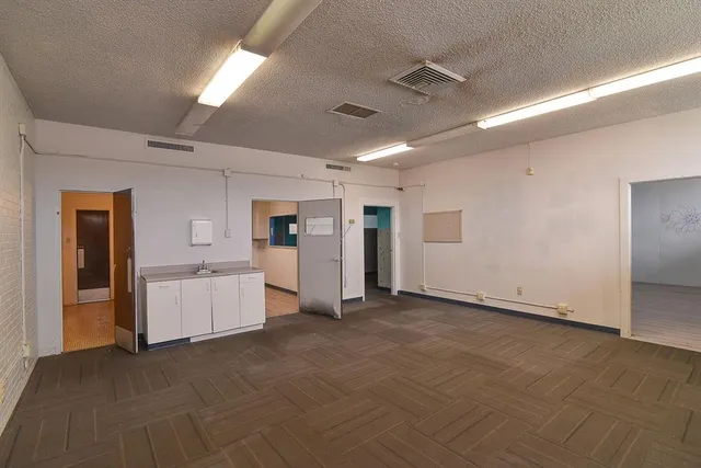 a view of a livingroom with wooden floor