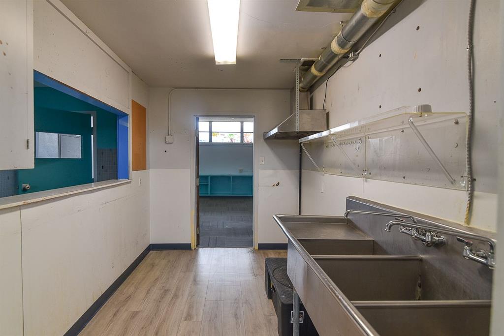 4403 Phillips Drive Wichita Falls, TX 76308 - Photo 36 of 40 a view of an empty room with wooden floor and a window