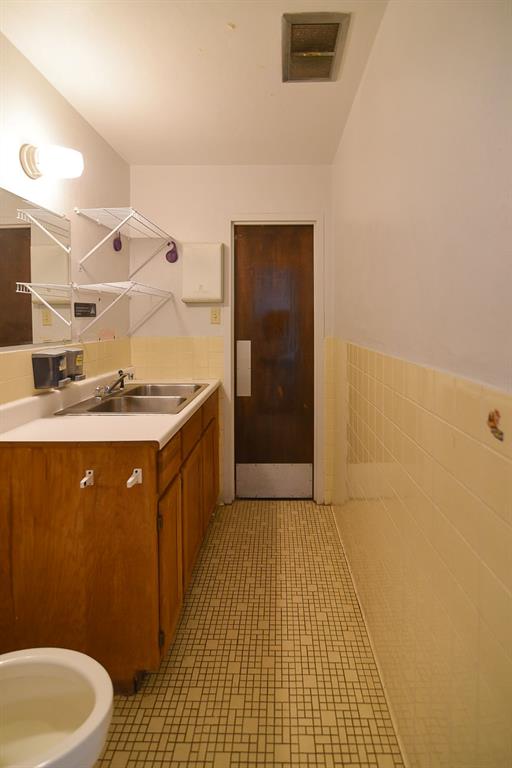 4403 Phillips Drive Wichita Falls, TX 76308 - Photo 37 of 40 a bathroom with a sink a toilet and shower