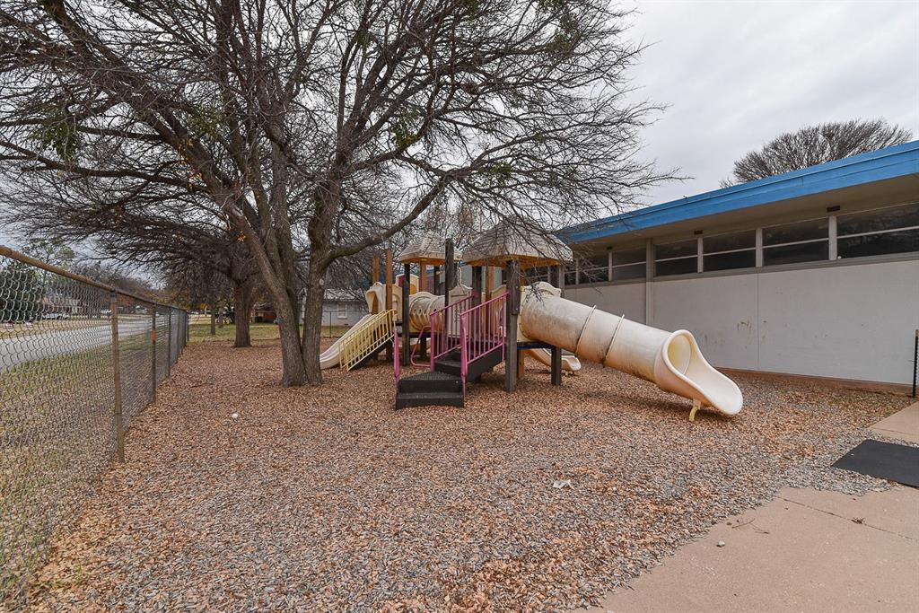 4403 Phillips Drive Wichita Falls, TX 76308 - Photo 38 of 40 a view of a house with a yard and sitting area