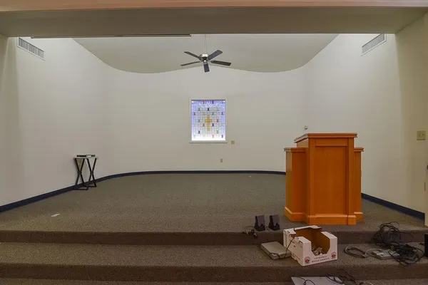 a room with gym equipment and a large window