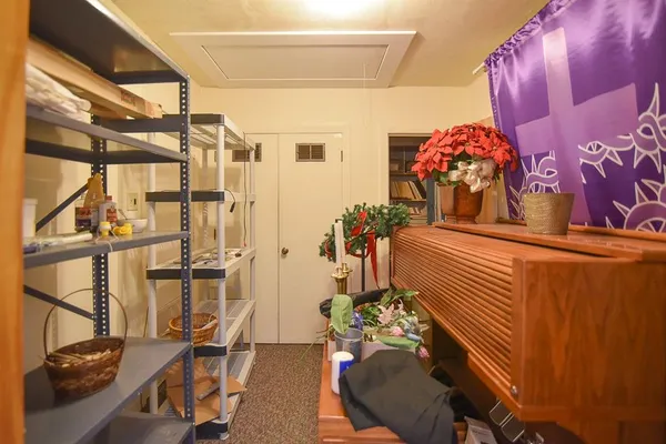 a living room with furniture and flowers