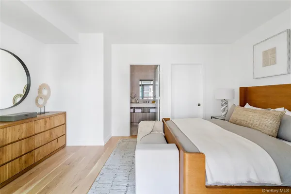 a bedroom with a bed and dresser