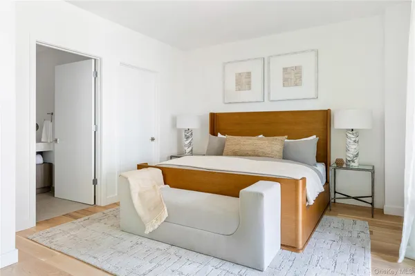 a spacious bedroom with a bed and a couch