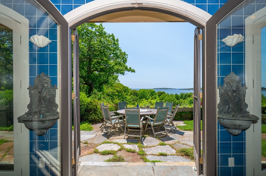 965-973 Hale Street Beverly, MA 01915 - Photo 14 of 42 a view of a patio with table and chairs potted plants