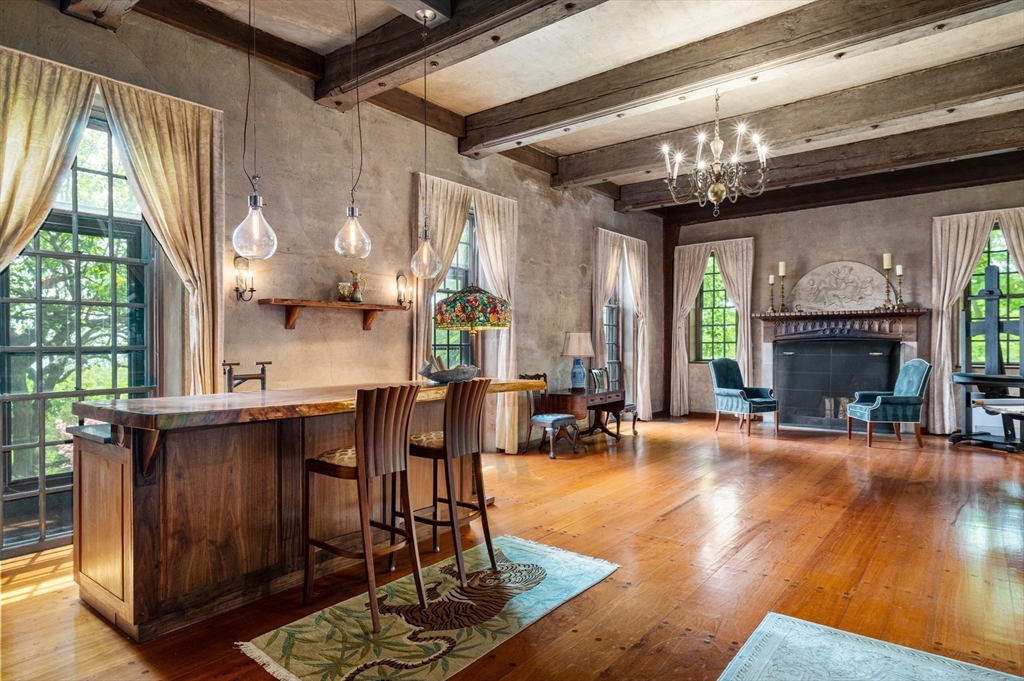 965-973 Hale Street Beverly, MA 01915 - Photo 15 of 42 a view of a dining room with furniture a chandelier and wooden floor