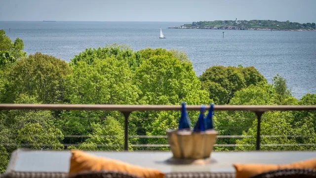 a view of lake from deck with seating space