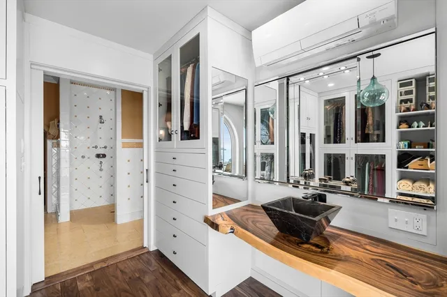 a living room with furniture a rug and a large window