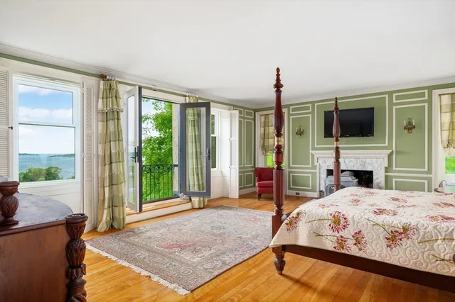 a living room with fireplace furniture and a flat screen tv