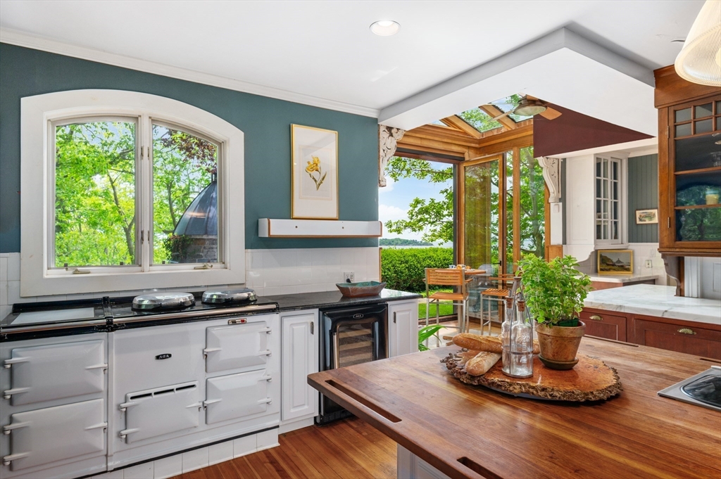 965-973 Hale Street Beverly, MA 01915 - Photo 7 of 42 a kitchen with a large window and cabinets