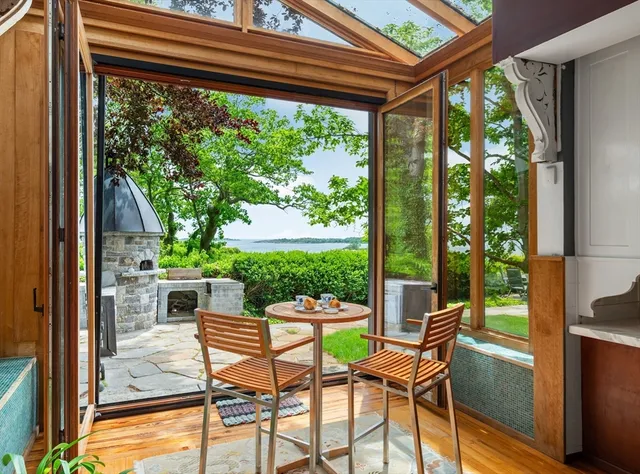 a patio with yard glass top table and chairs