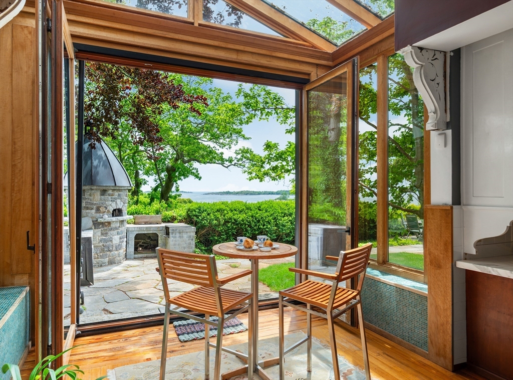 965-973 Hale Street Beverly, MA 01915 - Photo 8 of 42 a patio with yard glass top table and chairs
