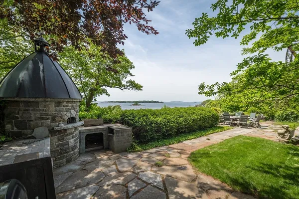 a backyard of a house with yard and outdoor seating