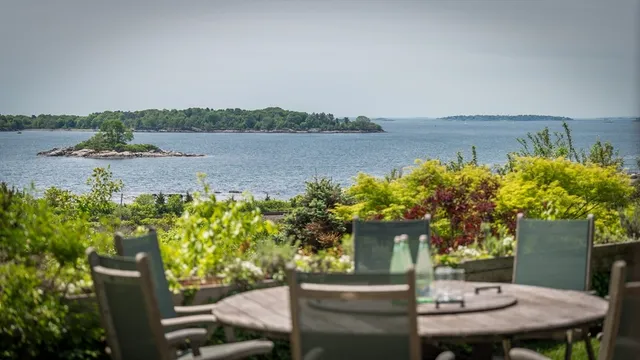 a view of a swimming pool and lounge chairs