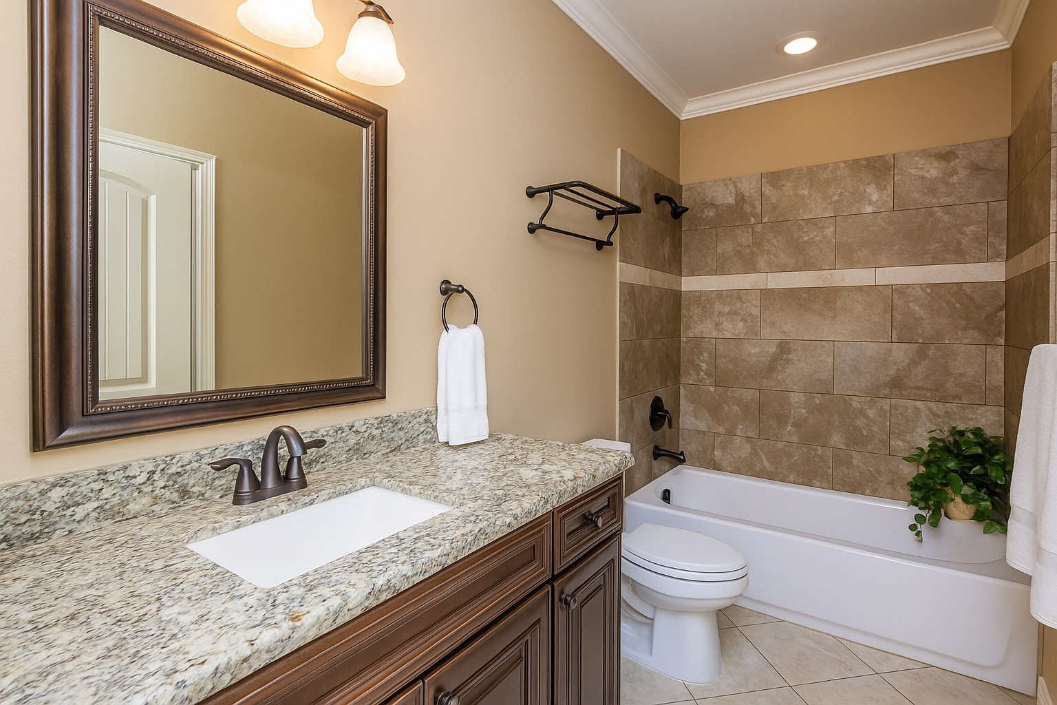 1516 Amundsen Street Houston, TX 77009 - Photo 27 of 32 a bathroom with a granite countertop sink a toilet and shower