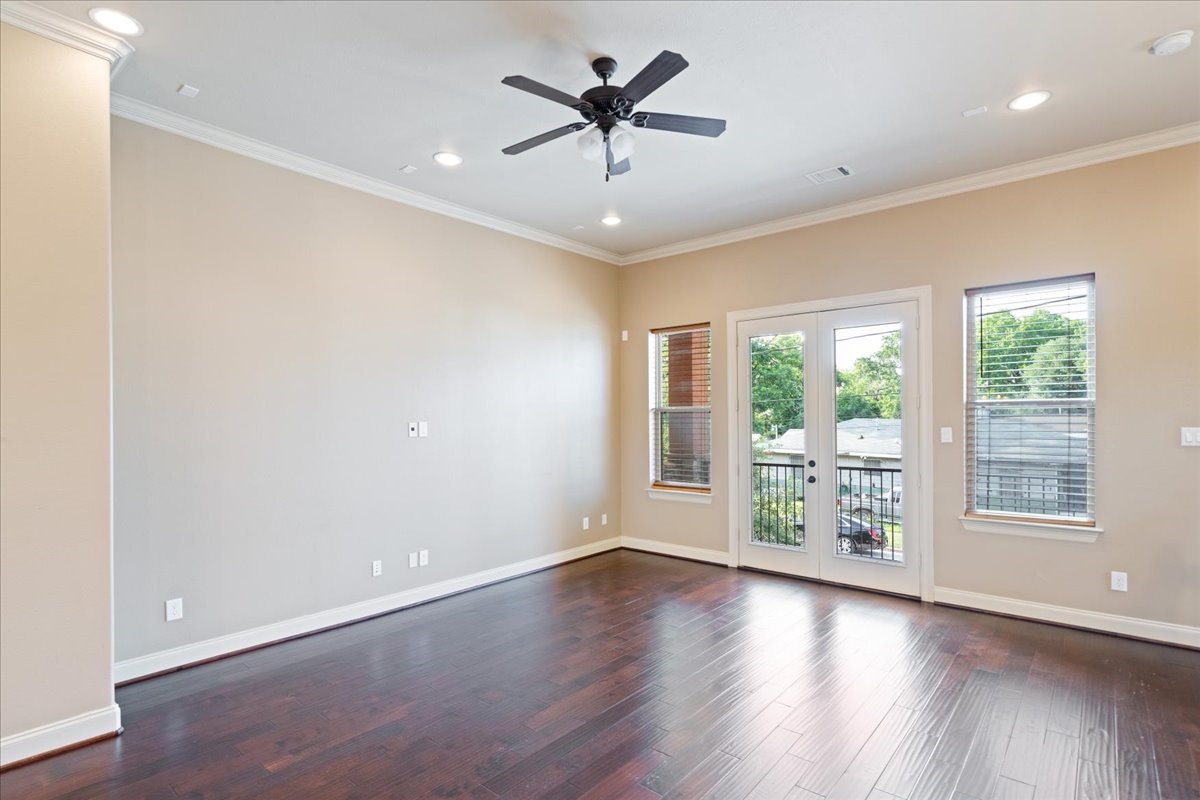 1516 Amundsen Street Houston, TX 77009 - Photo 9 of 32 wooden floor in an empty room with a window