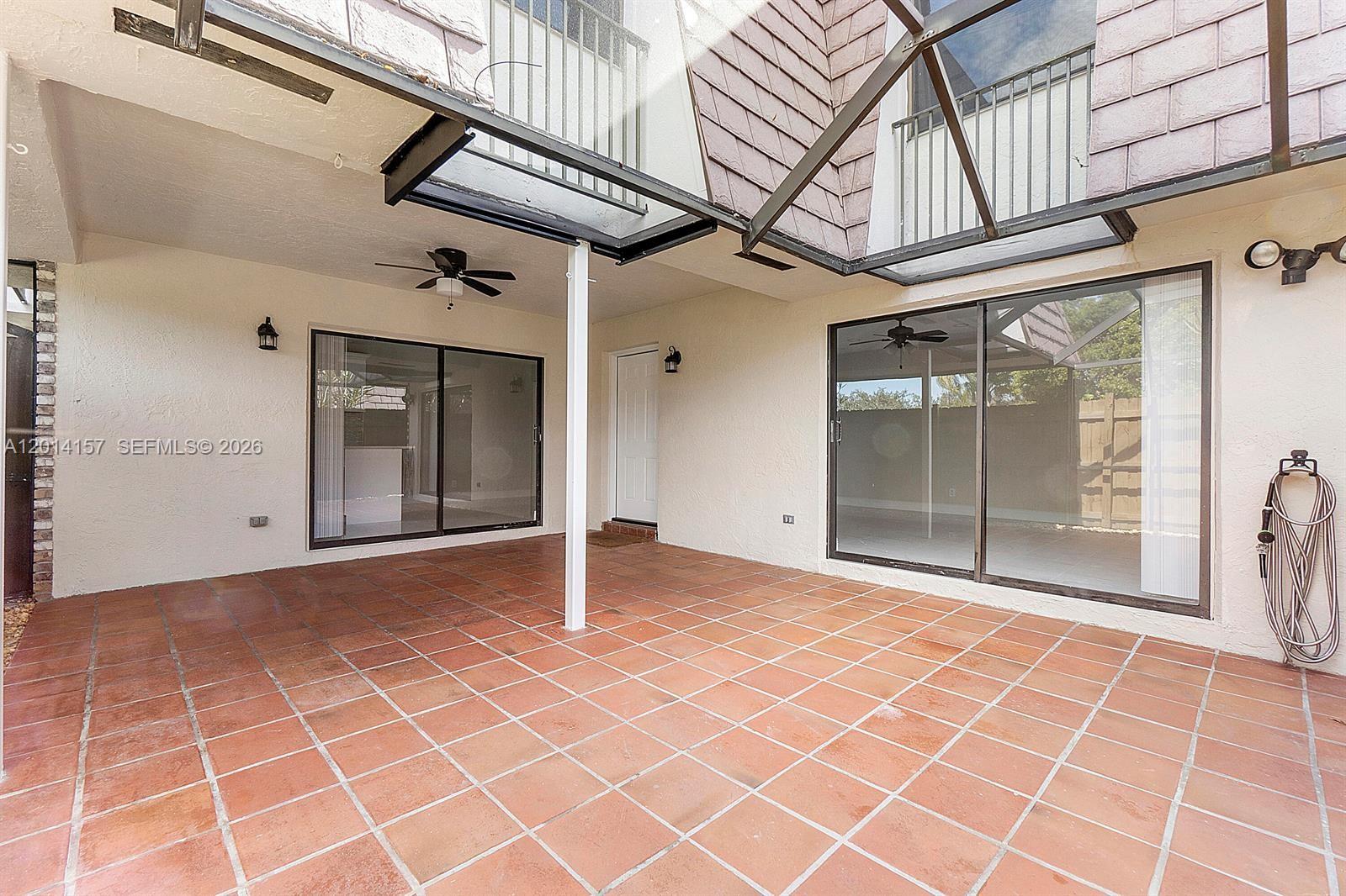 7744 Courtyard Run West Boca Raton, FL 33433 - Photo 18 of 25 a view of empty room with windows