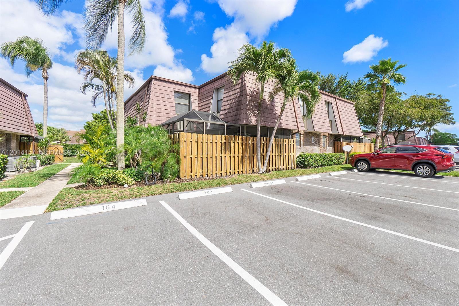 7744 Courtyard Run West Boca Raton, FL 33433 - Photo 19 of 25 a view of multiple houses with a street