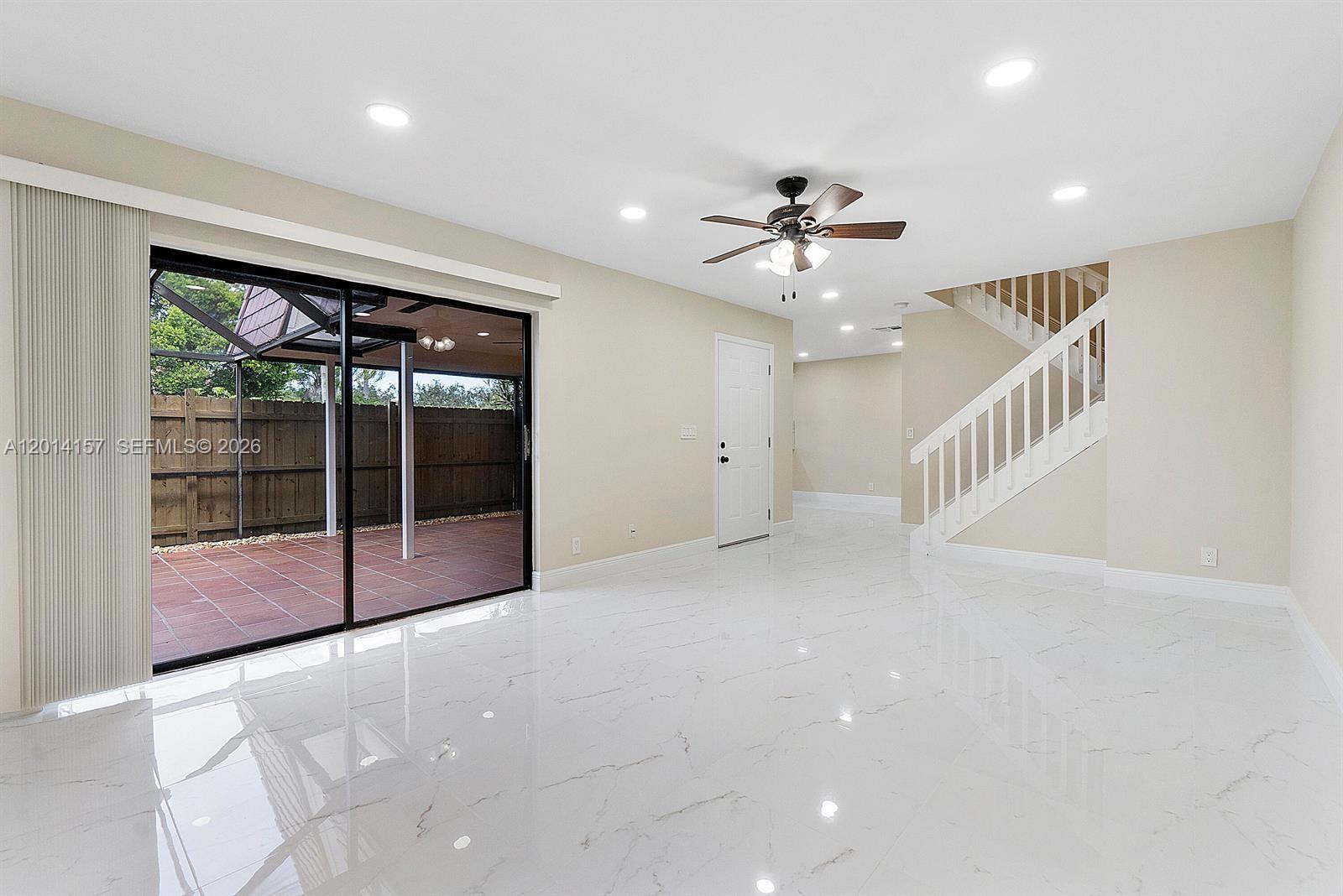 7744 Courtyard Run West Boca Raton, FL 33433 - Photo 5 of 25 a view of an empty room with a window